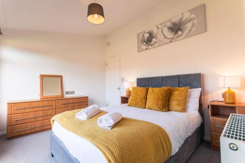 Säng eller sängar i ett rum på Chestnut Lodge With Hot Tub