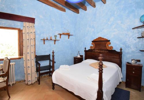 En eller flere senge i et værelse på Villa Can Bisbe 187 by Mallorca Charme