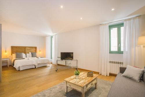 Postel nebo postele na pokoji v ubytování Apartaments Catedral – Baltack Homes