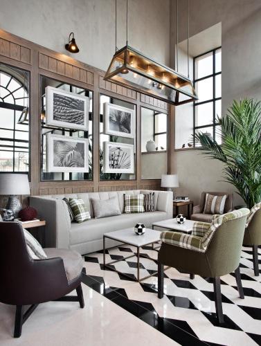 a living room with a couch and a table at Vincci Ponte de Ferro in Vila Nova de Gaia