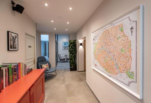 a hallway with a large map on the wall at Hôtel de L'Esperance in Paris