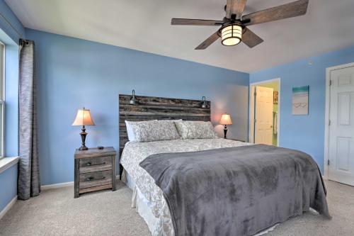 a bedroom with a bed and a ceiling fan at The Lake Escape with Balcony and Pool Access! in Camdenton