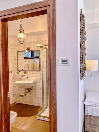 a bathroom with a sink and a mirror at Tenuta Novecento Bioagriturismo in Agerola