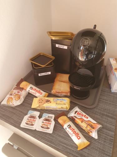 a kitchen counter with a slow cooker and some food at Brosi 11 in Forlì