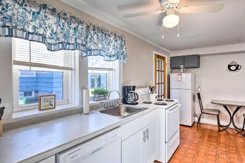 a kitchen with a sink and a refrigerator at Newport House Less Than 3 Mi to Beaches and Bowens Wharf! in Newport