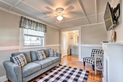 a living room with a couch and a tv at Newport House Less Than 3 Mi to Beaches and Bowens Wharf! in Newport