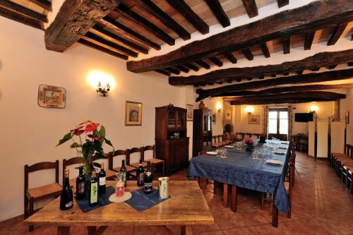 a dining room with a table with a blue table cloth at Agriturismo Sasso Rosso in Capodacqua