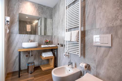 a bathroom with a sink and a mirror at Borgo di Drugolo in Lonato del Garda