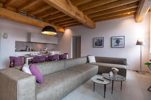 a living room with a couch and a table at Borgo di Drugolo in Lonato del Garda