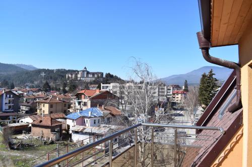 a view of the city from a balcony at Къща за гости Шошови in Velingrad