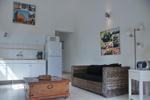 a living room with a couch and a table at Bantopa Apartments in Willemstad