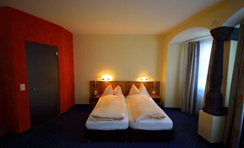 Postel nebo postele na pokoji v ubytování Ambiente Hotel Freieck