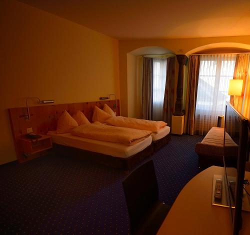 Postel nebo postele na pokoji v ubytování Ambiente Hotel Freieck