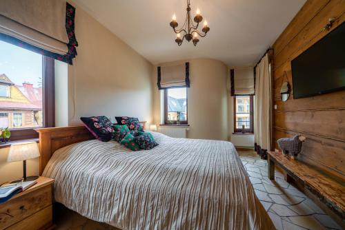 Posteľ alebo postele v izbe v ubytovaní Apartament Zielony Blisko Krupówek