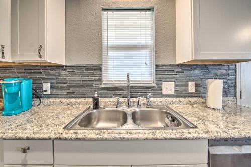 a kitchen counter with a sink and a window at Lees Summit Home Less Than 4 Mi to Dtwn Main Street in Lees Summit