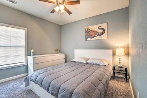 a bedroom with a bed and a ceiling fan at Lees Summit Home Less Than 4 Mi to Dtwn Main Street in Lees Summit