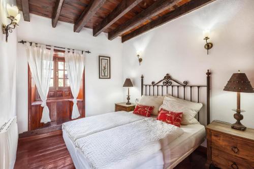 Postel nebo postele na pokoji v ubytování Finca Los Viñedos Casa Rural