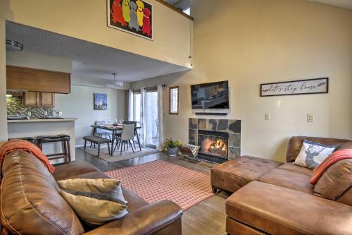a living room with two couches and a fireplace at Manitou Springs Escape with AandC and Private Deck! in Manitou Springs
