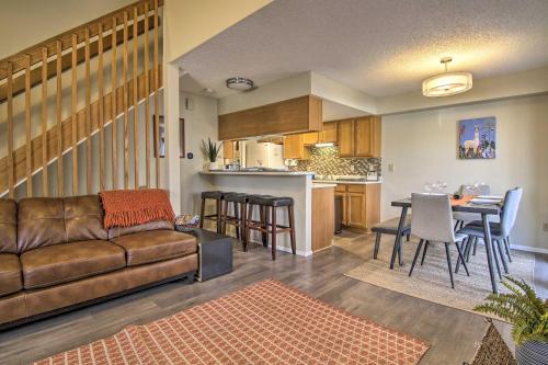 a living room and kitchen with a couch and a table at Manitou Springs Escape with AandC and Private Deck! in Manitou Springs