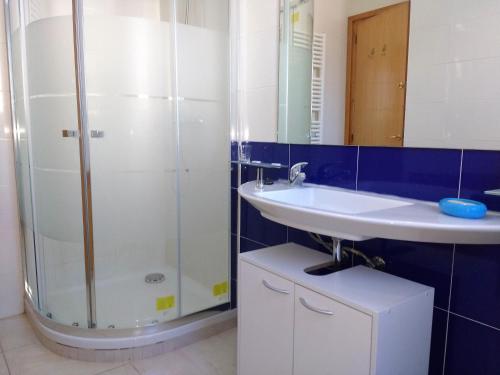 a bathroom with a shower and a sink at AME737 in Les tres Cales