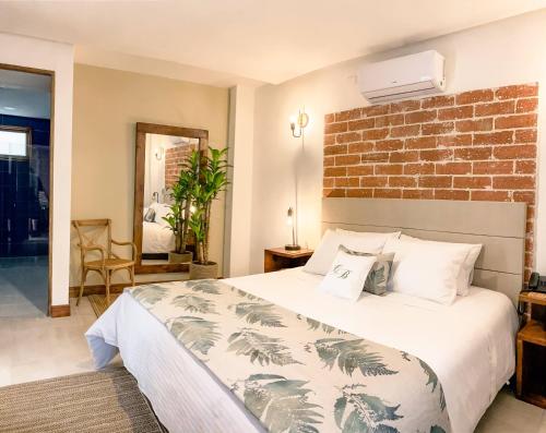 מיטה או מיטות בחדר ב-Casa Bixa Hotel Boutique - Solo Adultos