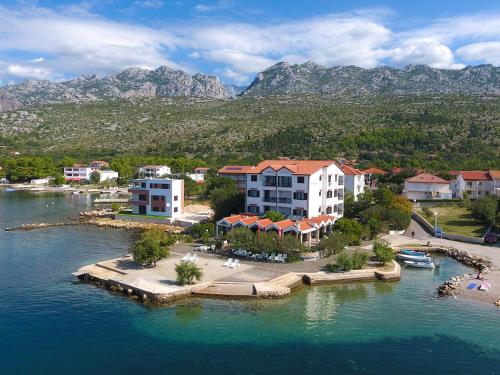 an aerial view of a resort on a body of water at Pansion Croatia in Starigrad-Paklenica