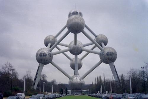a large metal structure with a clock on top of it at Hotel The Moon in Brussels
