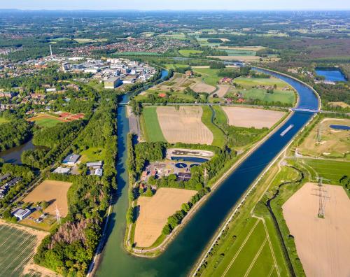 an aerial view of a river with houses and crops at Best Western Premier Seehotel Krautkrämer in Münster