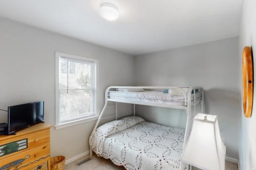 Una cama o camas en una habitación de Nautilus #44-7