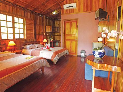 Postel nebo postele na pokoji v ubytování Ciudad Perdida EcoLodge