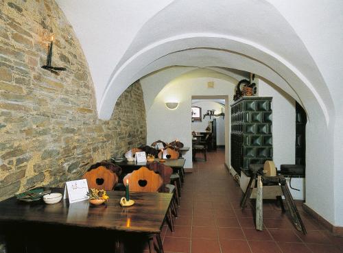 a restaurant with pumpkins on tables in a room at Pension und Gaststätte "Zur Brauschänke" in Schöneck