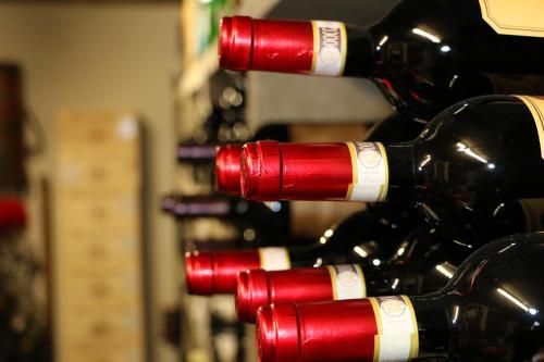 a bunch of red wine bottles in a store at Hotel Seehof Superior in Walenstadt