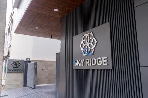 a sign on the side of a building at Sky Ridge in Vijayawāda