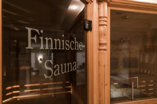 a window with the words finnesse samurai on it at Wohlfühlhotel Berwanger Hof in Obermaiselstein