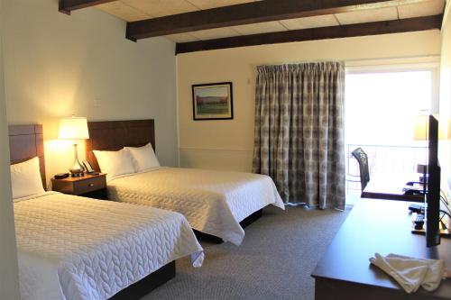 Ένα ή περισσότερα κρεβάτια σε δωμάτιο στο Shenvalee Golf Resort