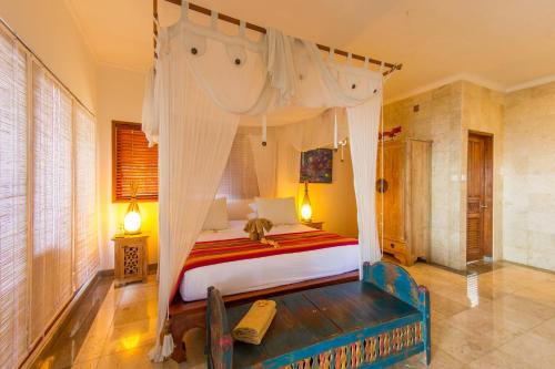 A bed or beds in a room at Aquamarine Seaview Villa