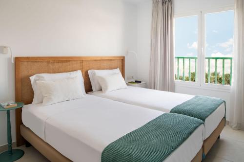 Postel nebo postele na pokoji v ubytování Nazaret Apartments