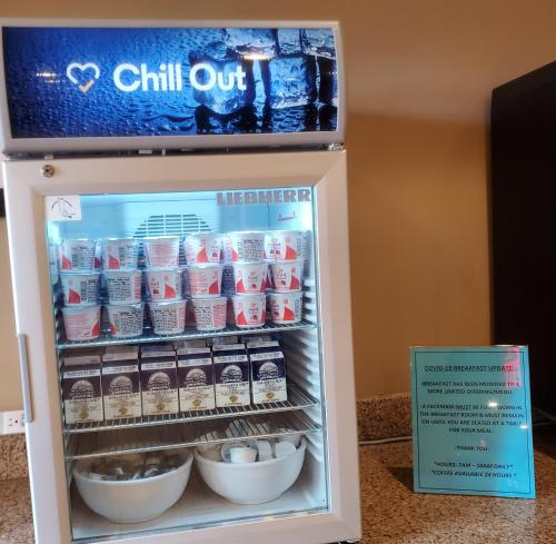 a refrigerator filled with milk and other food at Comfort Inn & Suites Tempe Phoenix Sky Harbor Airport in Tempe