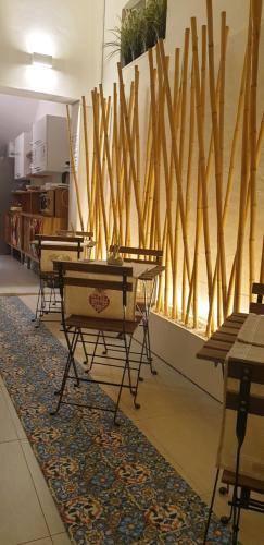 a room with a ping pong table on a rug at Bed Nonnonino in Porto Cesareo