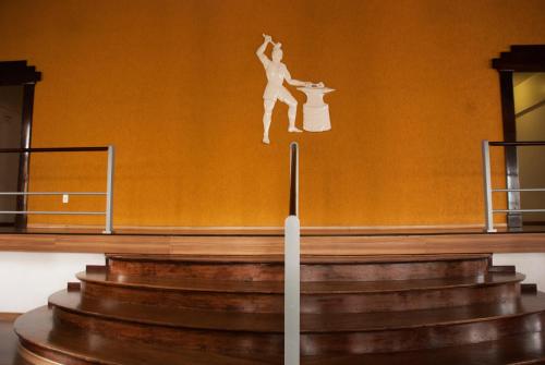 a painting of a ballet dancer on a wall at Hara Palace Hotel in Curitiba