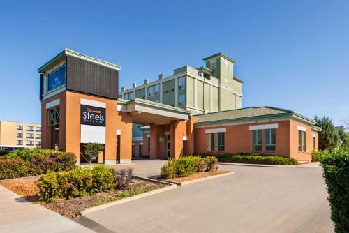 a building with a sign in front of it at Royal Hotel Regina, Trademark Collection by Wyndham in Regina