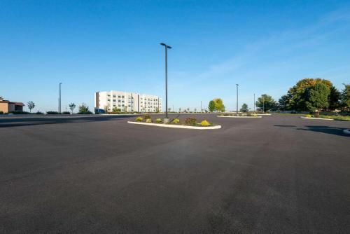 an empty parking lot with a street light and a building at Wyndham Lancaster Resort and Convention Center in Lancaster