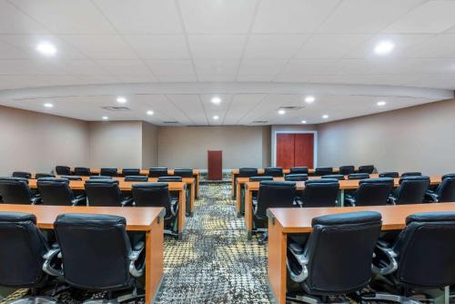 a conference room with desks and chairs in it at Wyndham Lancaster Resort and Convention Center in Lancaster