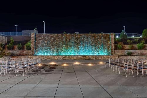 a row of chairs and a wall with blue lights at Wyndham Lancaster Resort and Convention Center in Lancaster