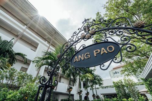 a sign for anping pago in front of a building at Ang Pao Hotel Phuket in Phuket Town