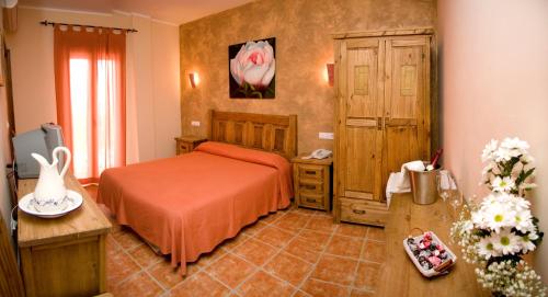 Cama o camas de una habitación en Hotel Rural El Arriero