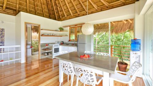 a kitchen with a table and chairs in a room at Diniview Villa Resort in Boracay