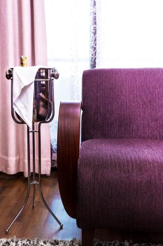 a camera sitting next to a purple chair in a room at Salana Boutique Hotel in Vientiane