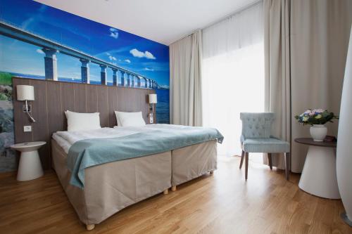 Postel nebo postele na pokoji v ubytování Hotel Skansen