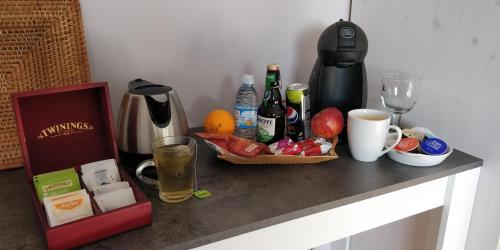 a counter top with a tray of food and drinks at Le bordon in Durnal